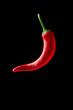Photo: Hot chilli pepper over black background Hot chilli pepper over black background