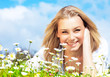 Happy girl enjoying daisy flower field Happy girl enjoying daisy flower field