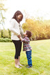Pregnant Asian mother and her son
