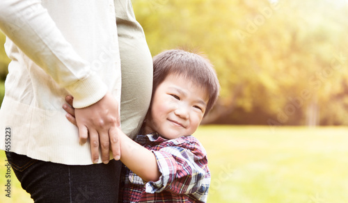 Photo: Pregnant Asian mother and her son Pregnant Asian mother and her son