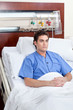 Patient sitting on bed