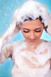 woman washing her hair with shampoo woman washing her hair with shampoo