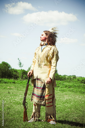 Photo: North American Indian in full dress. Reconstruction North American Indian in full dress. Reconstruction