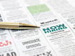 Pen on the newspaper career opportunity ad.