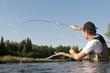 Fliegenfischer im Fluss