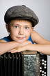 Smiling boy with accordion