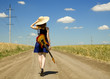 Rock girl with guitar at countryside.