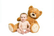 Baby vor großem Teddy
