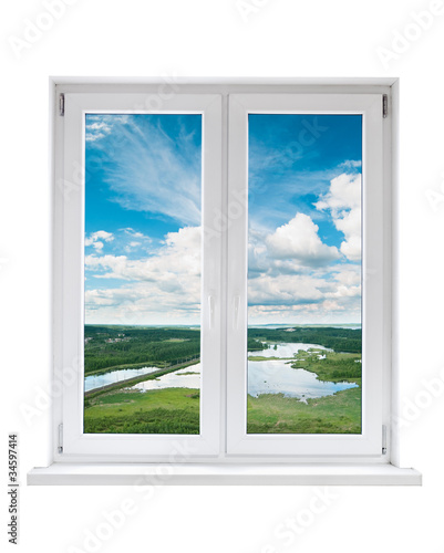 Photo: White plastic double door window with view to tranquil landscape White plastic double door window with view to tranquil landscape