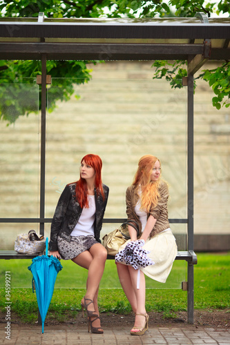 Photo: Two Girls at Bus Stop Two Girls at Bus Stop