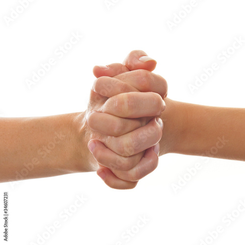 Photo: Hands of mother and child clasped Hands of mother and child clasped