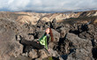 young woman sunbathing at Landmannalaugar, Iceland