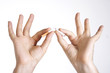 Man's hands breaking a cigarette