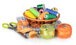 bright threads in basket, scissors and measuring tape