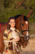 The woman in clothes of 18 centuries with horse The woman in clothes of 18 centuries with horse