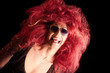 Drag Queen. Man dressed as Woman. On black.