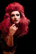 Drag Queen. Man dressed as Woman. On black.