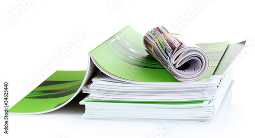 Photo: many magazines isolated on white many magazines isolated on white