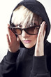 Portrait of a young, blonde girl with short hair and sunglasses Portrait of a young, blonde girl with short hair and sunglasses