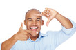 Smiling african young man making frame with finger
