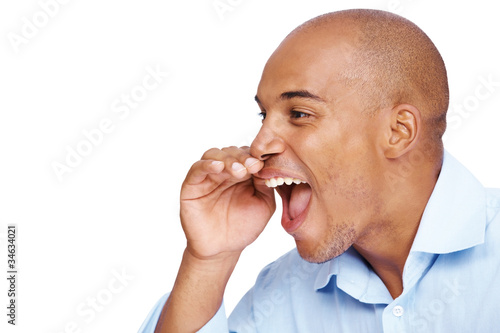 Photo: Shouting an announcement - Man screaming loud with hands Shouting an announcement - Man screaming loud with hands