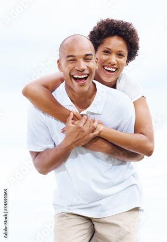 Photo: Loving young couple enjoying themselves - Outdoors Loving young couple enjoying themselves - Outdoors