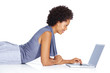 Young smiling woman using a laptop over white background
