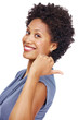 Smiling woman indicating back side on white background