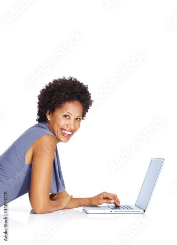 Photo: Young happy woman with a laptop Young happy woman with a laptop