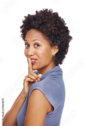 Photo: Young female gesturing you to keep silence Young female gesturing you to keep silence