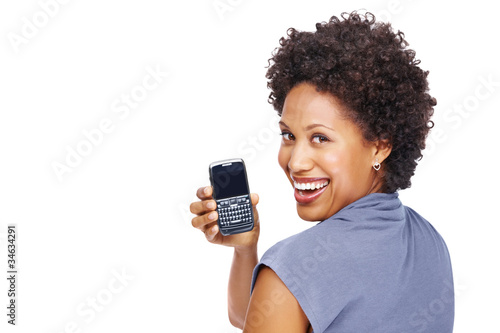 Photo: Cheerful young woman showing her new mobile phone Cheerful young woman showing her new mobile phone