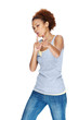 Young woman blowing away imaginary smoke from finger gun Young woman blowing away imaginary smoke from finger gun