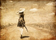 Rock girl with guitar at countryside.