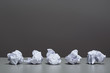 Crumpled paper on a gray background.