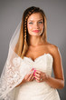 beautiful young bride on studio neutral background