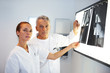 Medical team studying an X-ray in a lab