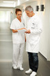 Two doctors discuss a patients medical ailment