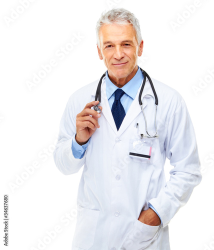 Photo: Portrait of a happy senior doctor standing on white Portrait of a happy senior doctor standing on white