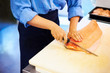 Slicing salmon on a board Slicing salmon on a board
