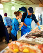 Beautiful woman buying fish Beautiful woman buying fish