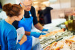Fishmonger helping a customer