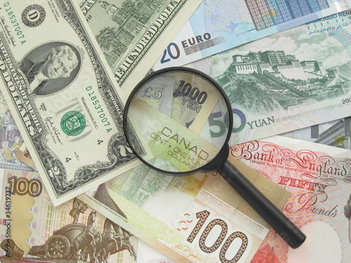 Photo: Banknotes and magnifier Banknotes and magnifier