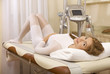 brunette lies on a massage bed