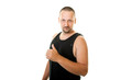 sporty young man in a black undershirt showing thumb