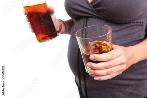 Photo: Pregnant Woman With a Glass of Whiskey Pregnant Woman With a Glass of Whiskey