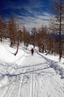 Woman snowshoeing descending