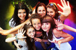 Group of young friends dancing at a night club Group of young friends dancing at a night club