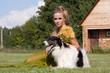 The woman in a beautiful old style dress with borzoi dogs The woman in a beautiful old style dress with borzoi dogs