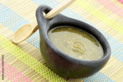 Photo: tomatillo sauce in colombian clay dish tomatillo sauce in colombian clay dish
