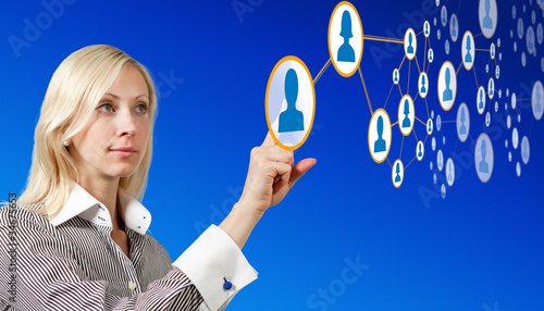 Photo: Businesswoman works with futuristic network Businesswoman works with futuristic network
